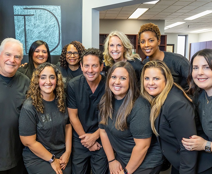 Smiling dentists and team members at Tzagournis Dental Group of Upper Arlington