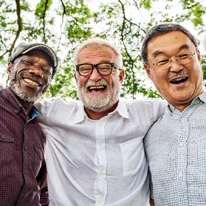 Dentures patient in Upper Arlington talking with friends