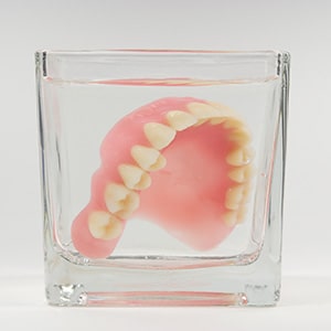 Dentures patient in Upper Arlington soaking their prosthetics