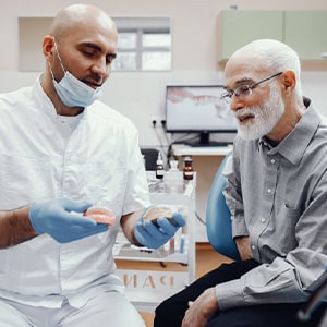 Dentures patient in Upper Arlington talking to dentist