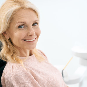 Woman smiling in the dental chair