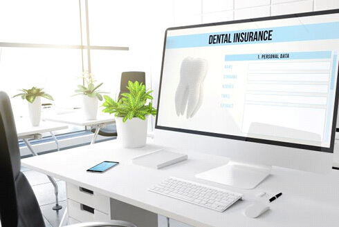 dental insurance form displayed on large computer monitor